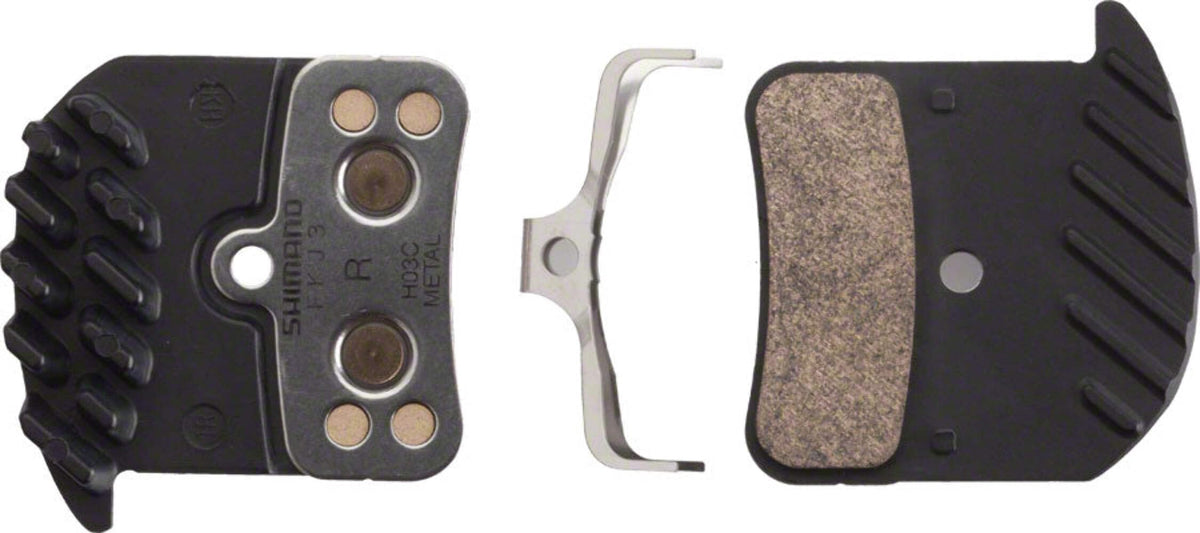 SHIMANO H03C brake pads front view showing spring and split pin, clear fit and reliability