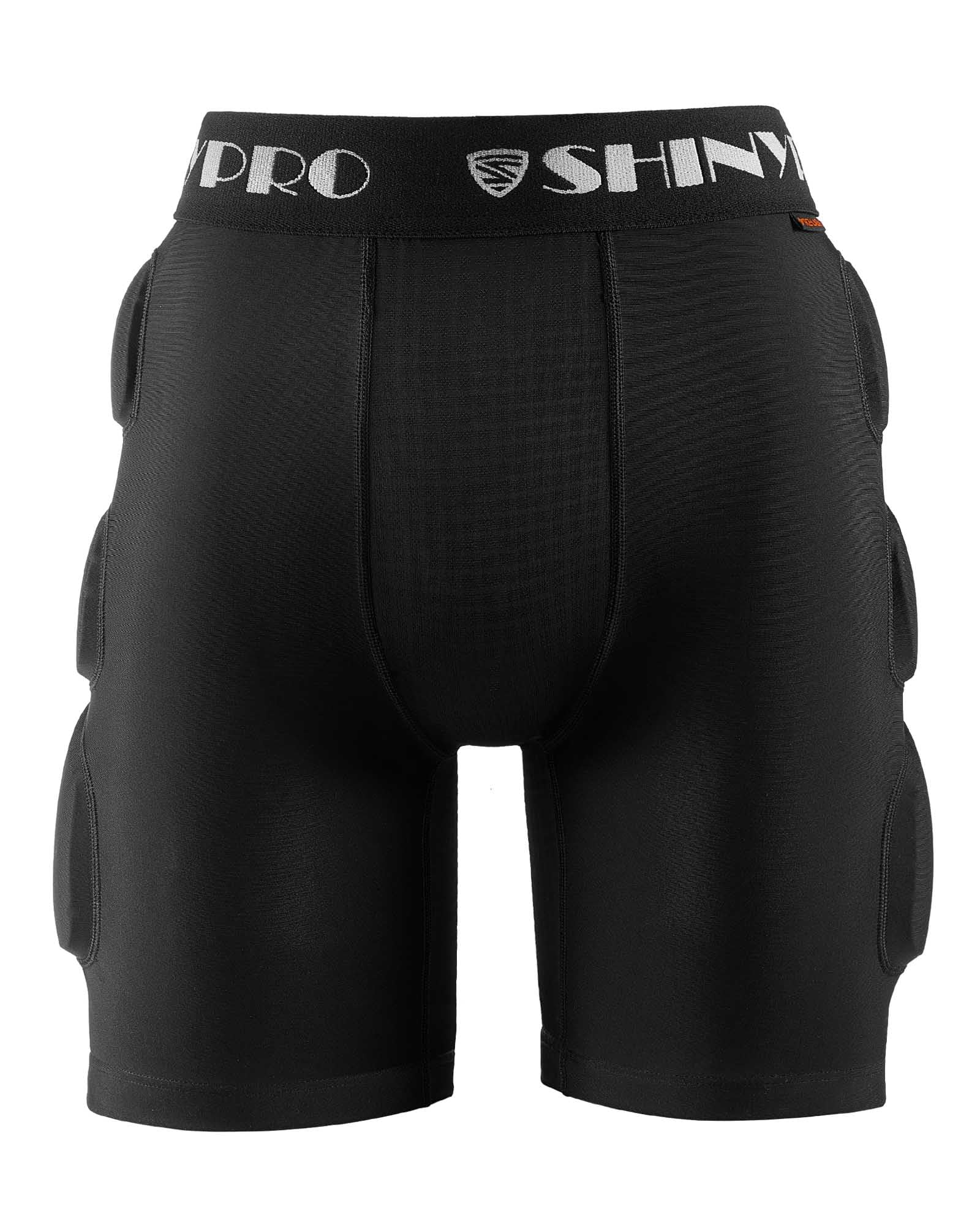 SHINYPRO shorts next to hand for scale to show compact protective profile