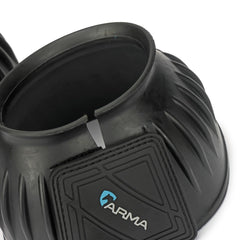 Shires Arma bell boot on horse in arena demonstrating secure movement