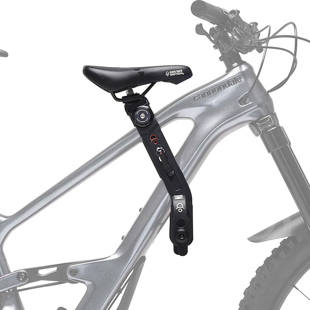SHOTGUN front-mounted child seat mounted on bike showing compact fit and close supervision