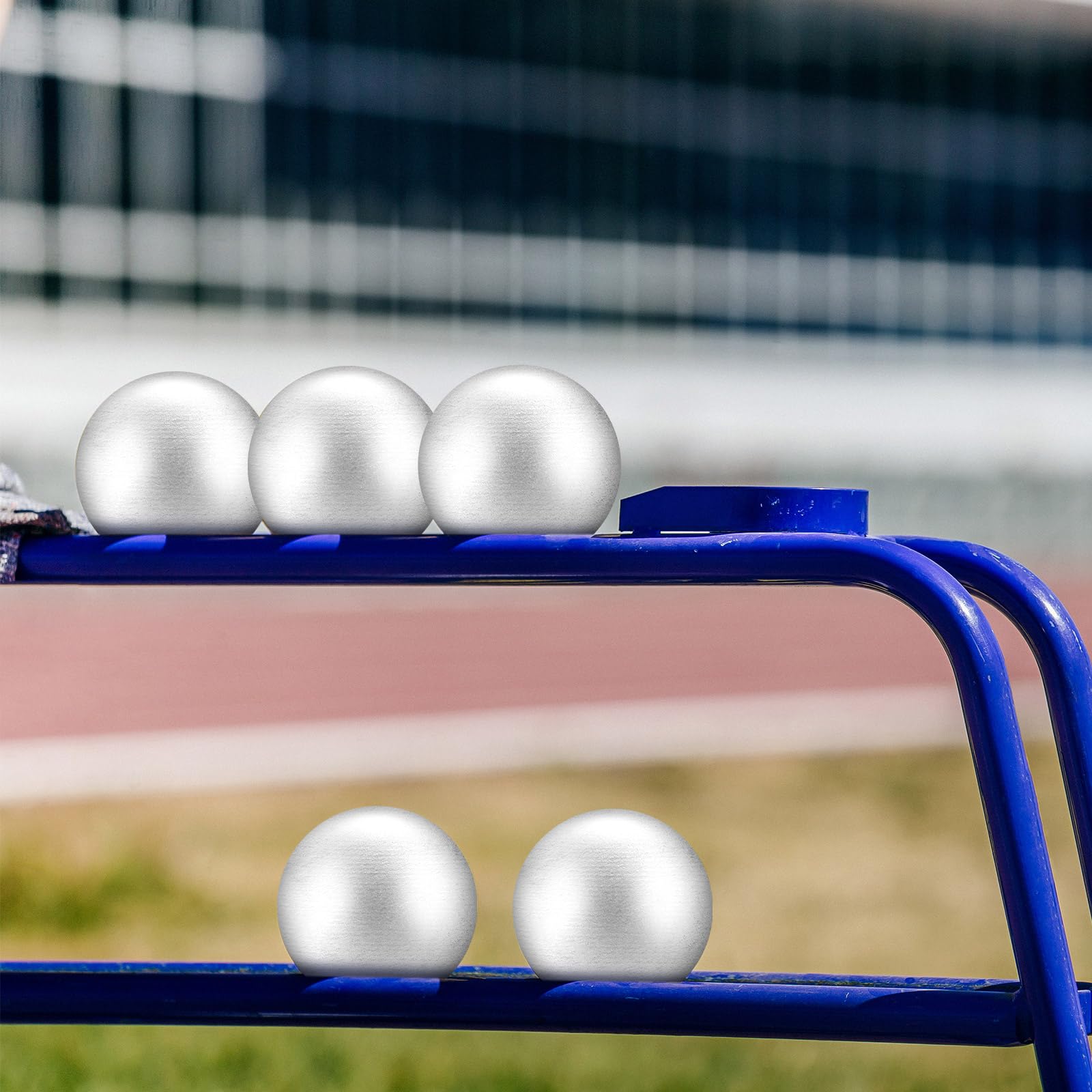 Silipull shot put resting on track surface illustrating outdoor use and practice readiness