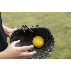 SKLZ plyo balls beside a glove for size comparison and clear scale reference benefit