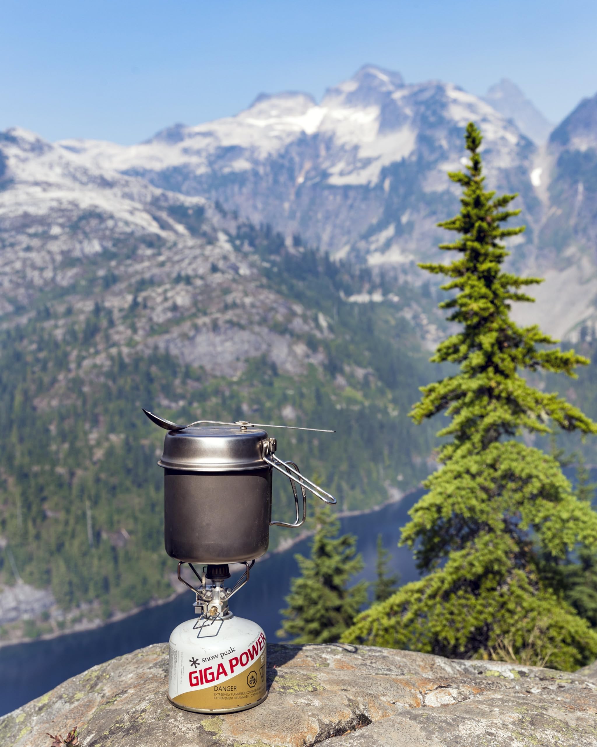 Snow Peak next to water bottle showing compact size and packability advantage