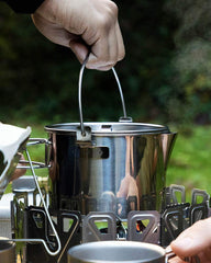 Snow Peak kettle folded-handle detail demonstrating space-saving design and safe carrying benefit