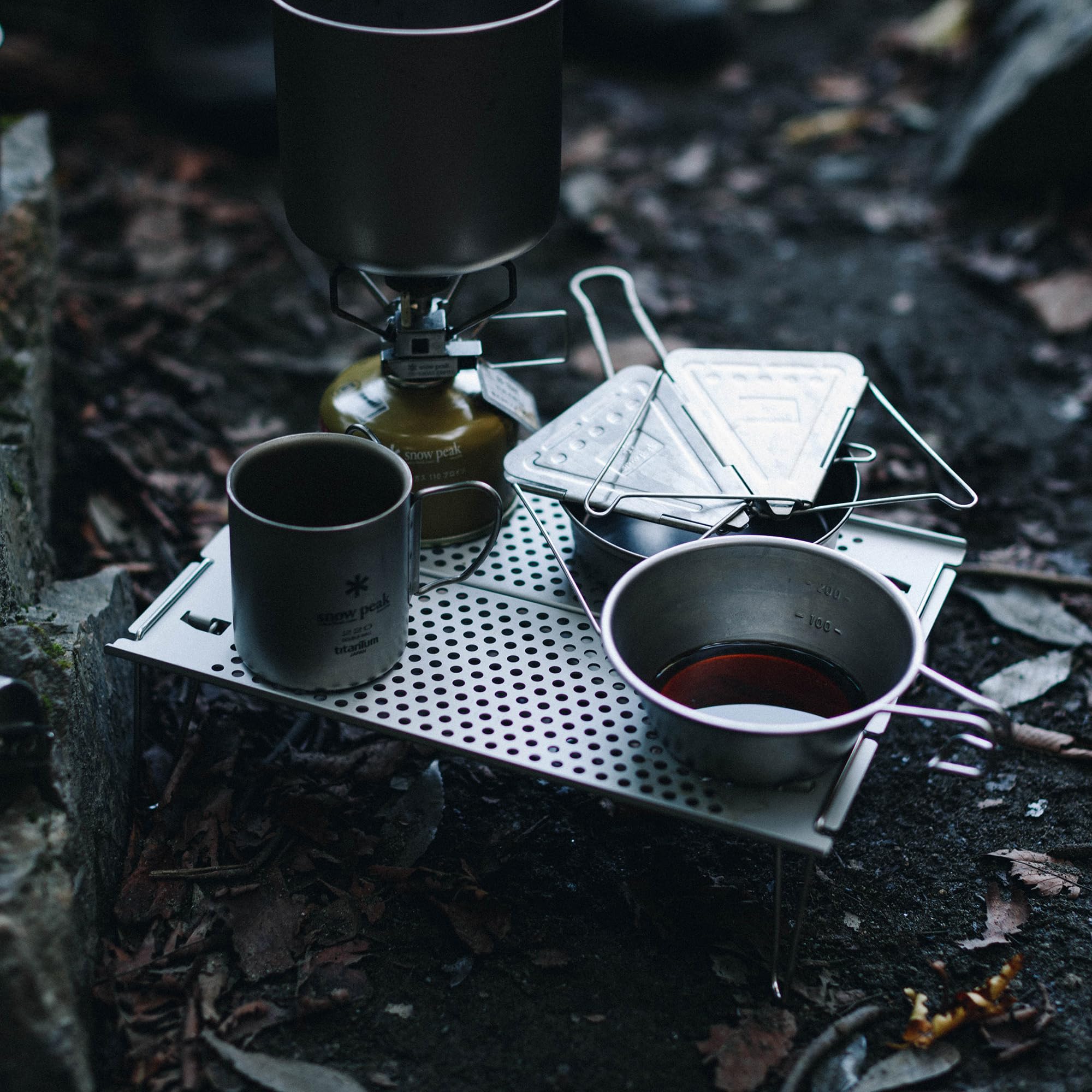 Snow Peak Ozen Solo Table in use with stove illustrating stable cooking platform benefit
