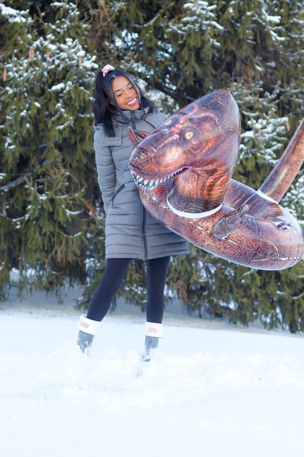 SNOWCANDY tube next to adult to show 42" size and capacity benefit