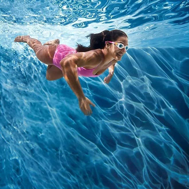 Speedo goggles beside hand showing size and travel-ready convenience