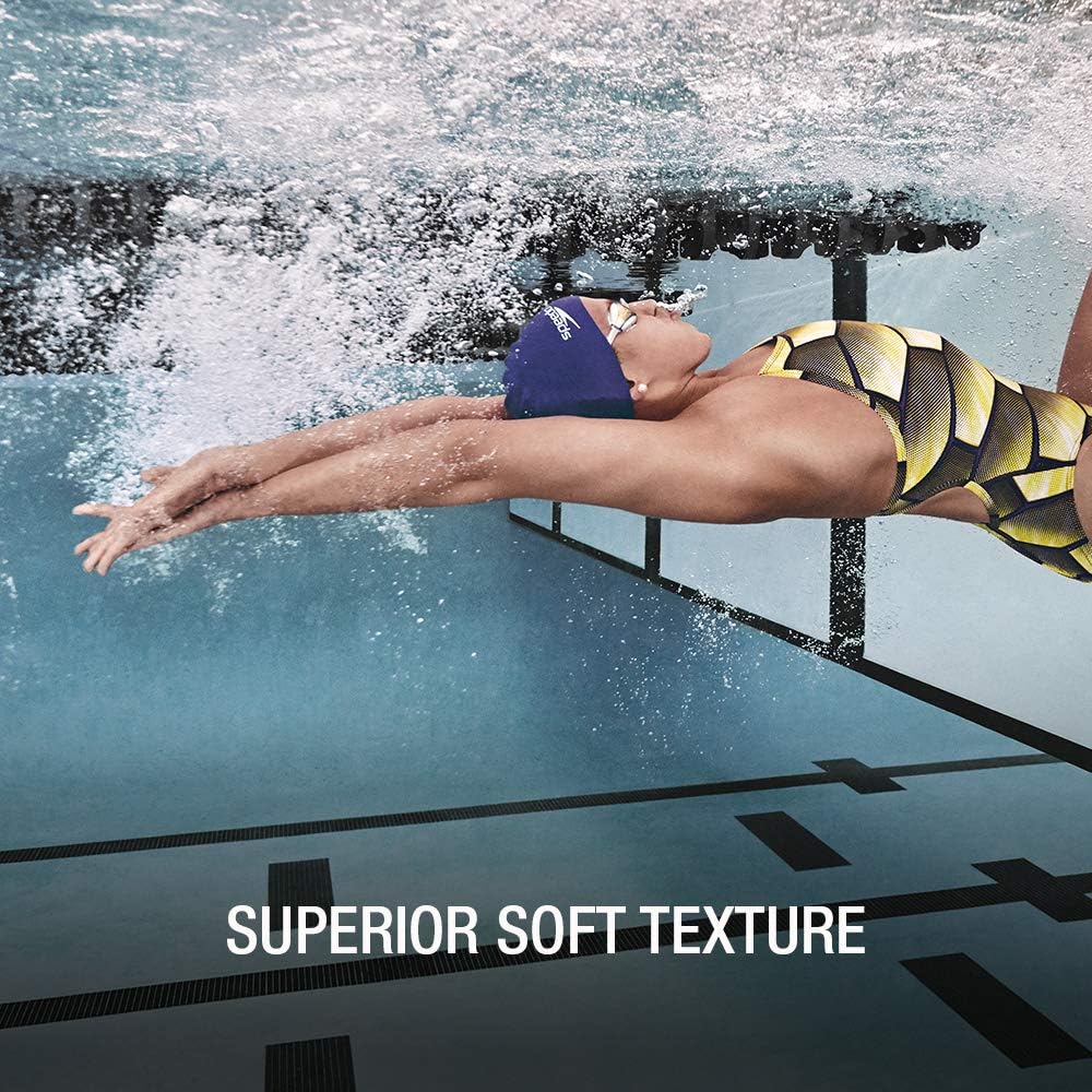 Speedo cap worn by swimmer in pool illustrating secure hair containment