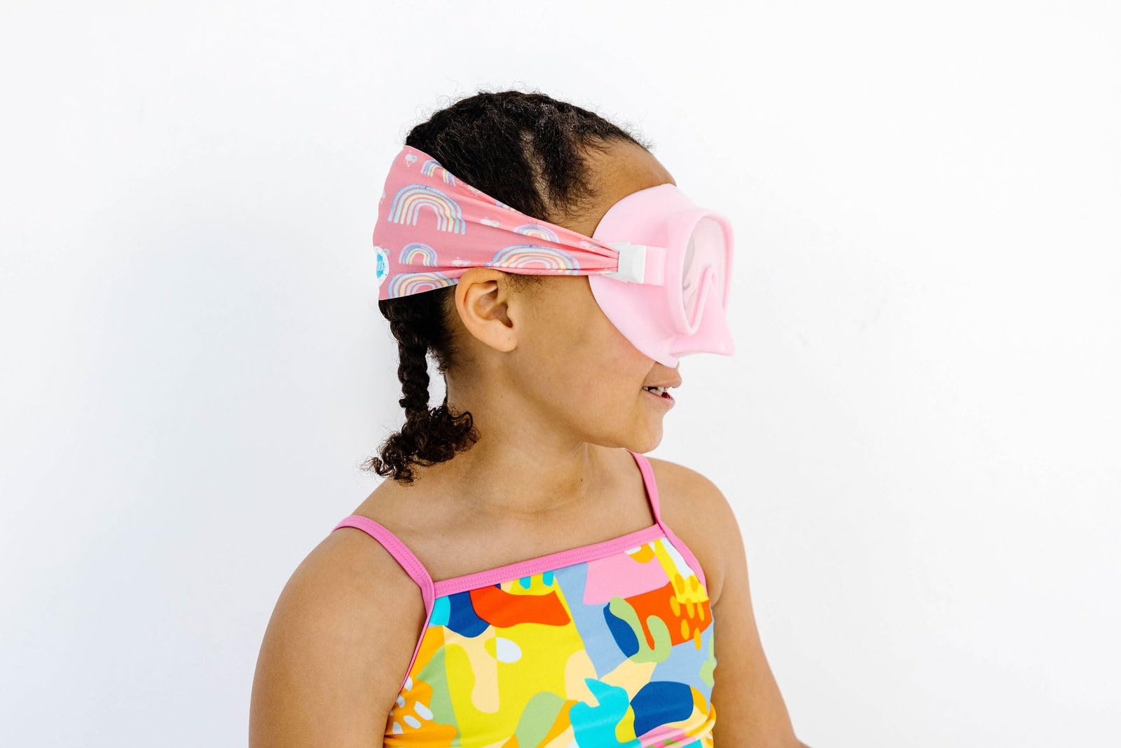 Splash Place goggles on towel showing travel-ready compactness