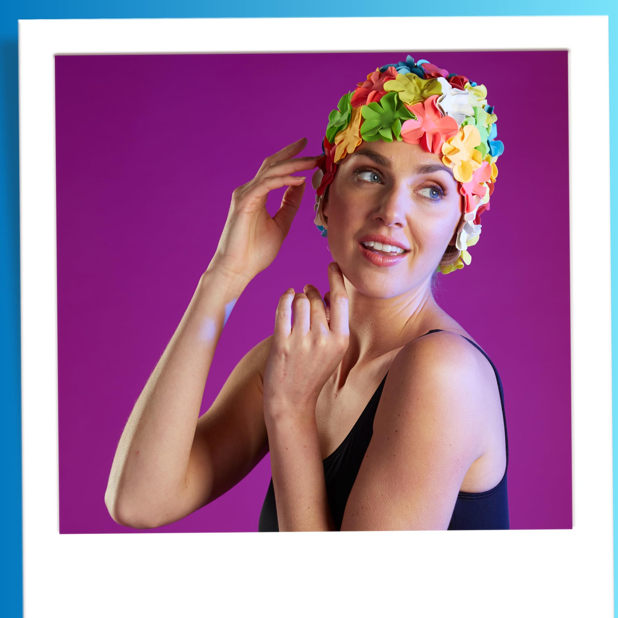 Sporti swim cap staged with towels suggesting ready-for-pool convenience