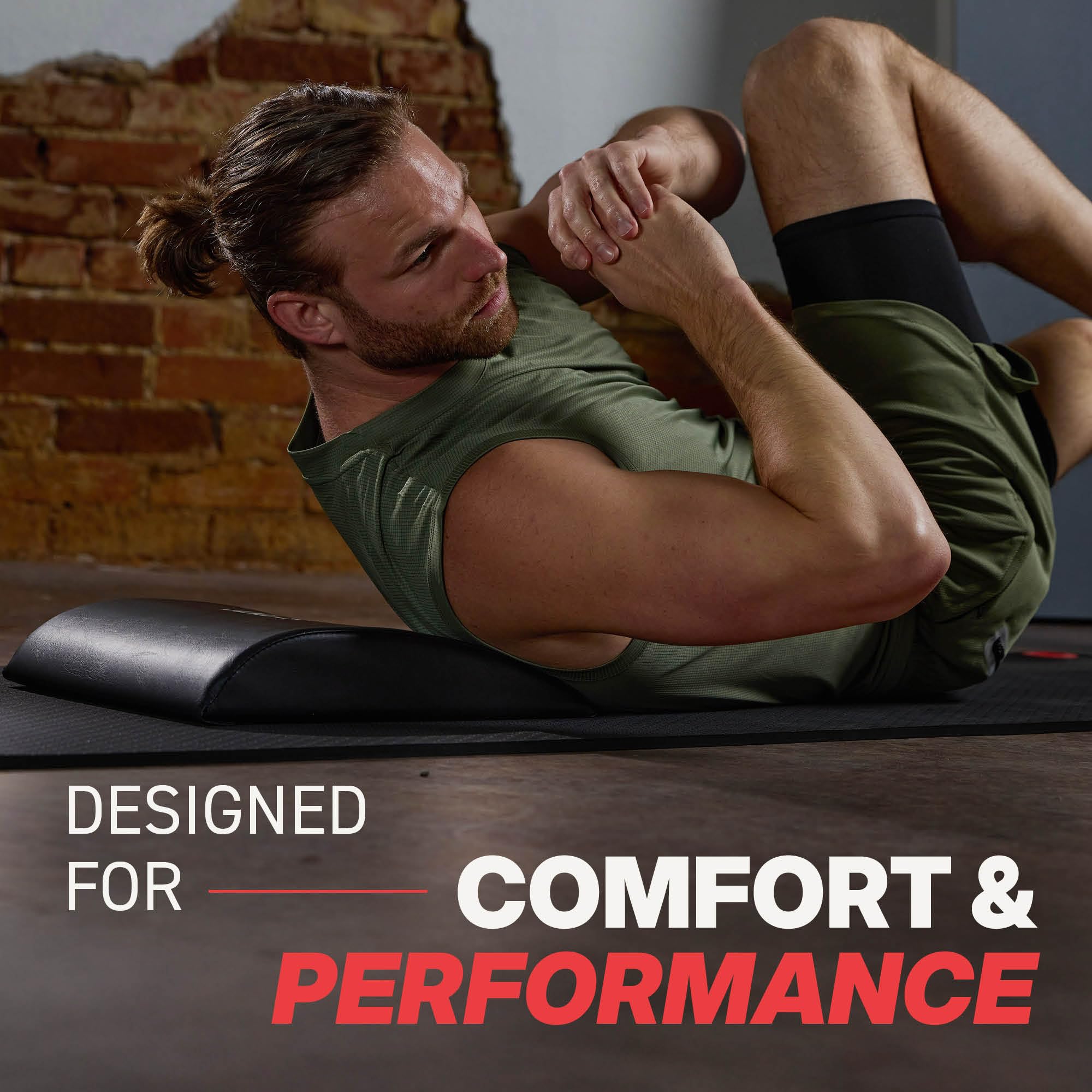 Person using SPRI Ab Mat for sit-up demonstrating deeper range of motion
