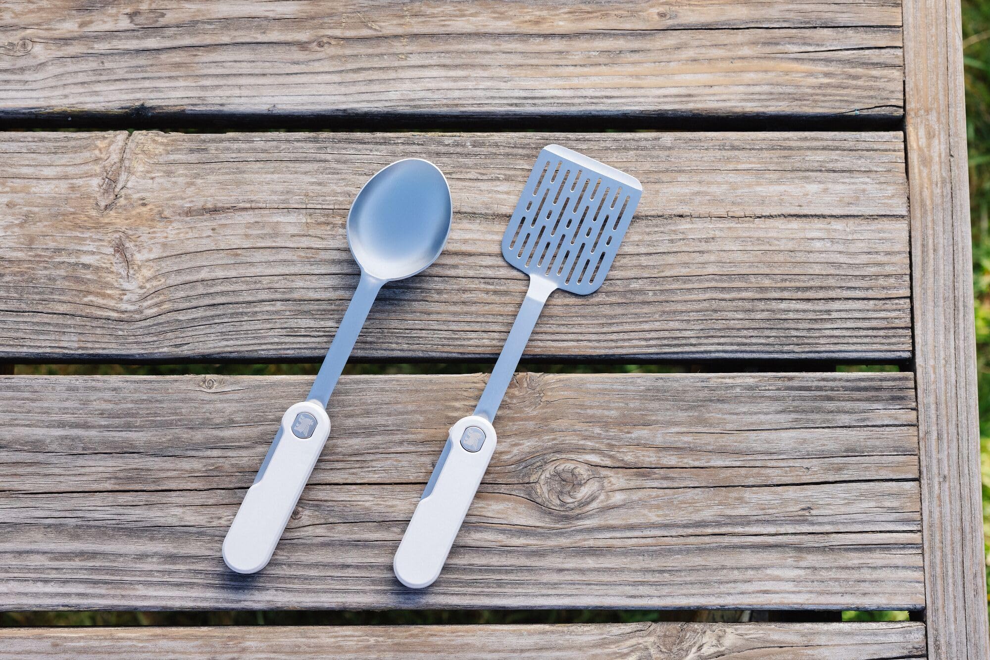 STANLEY utensils in use over camp skillet showing heat-safe handling benefit