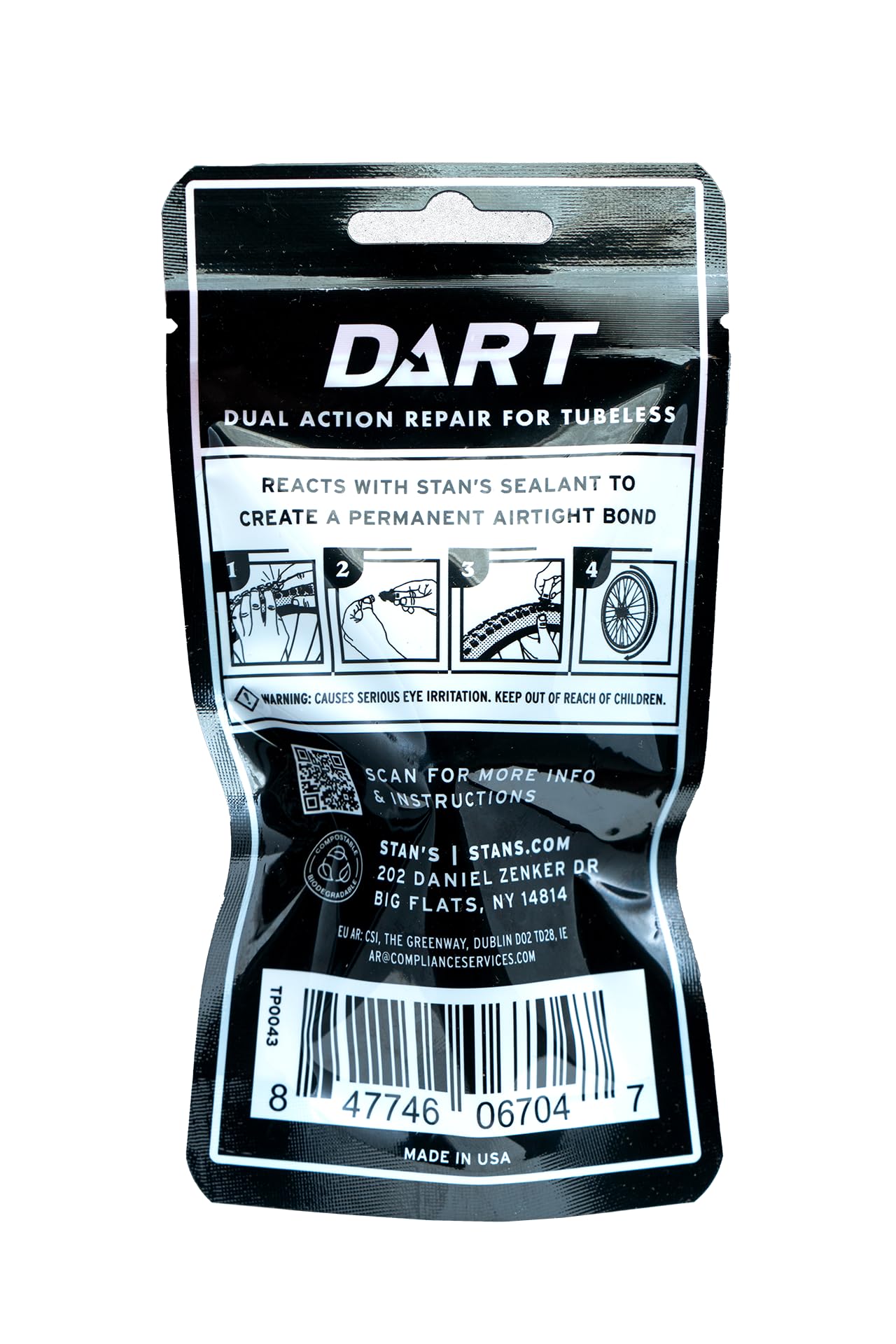 Stan's NoTubes DART tool being pushed into a tire on trail for fast roadside fix