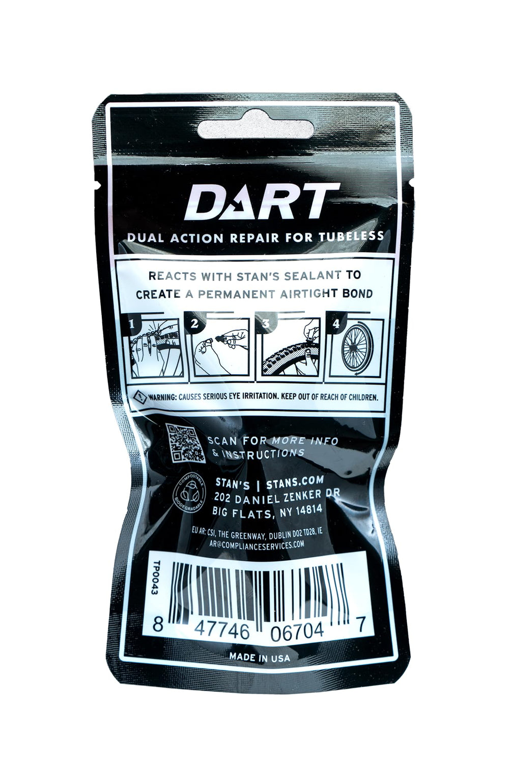 Stan's NoTubes DART tool being pushed into a tire on trail for fast roadside fix