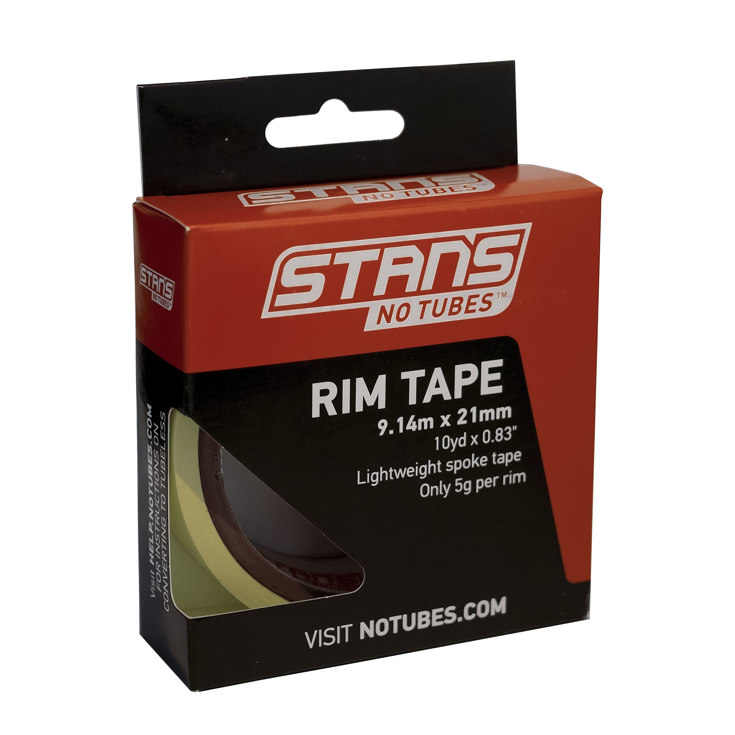 Stan's NoTubes rim tape on a wheel in a garage suggesting easy tubeless conversion