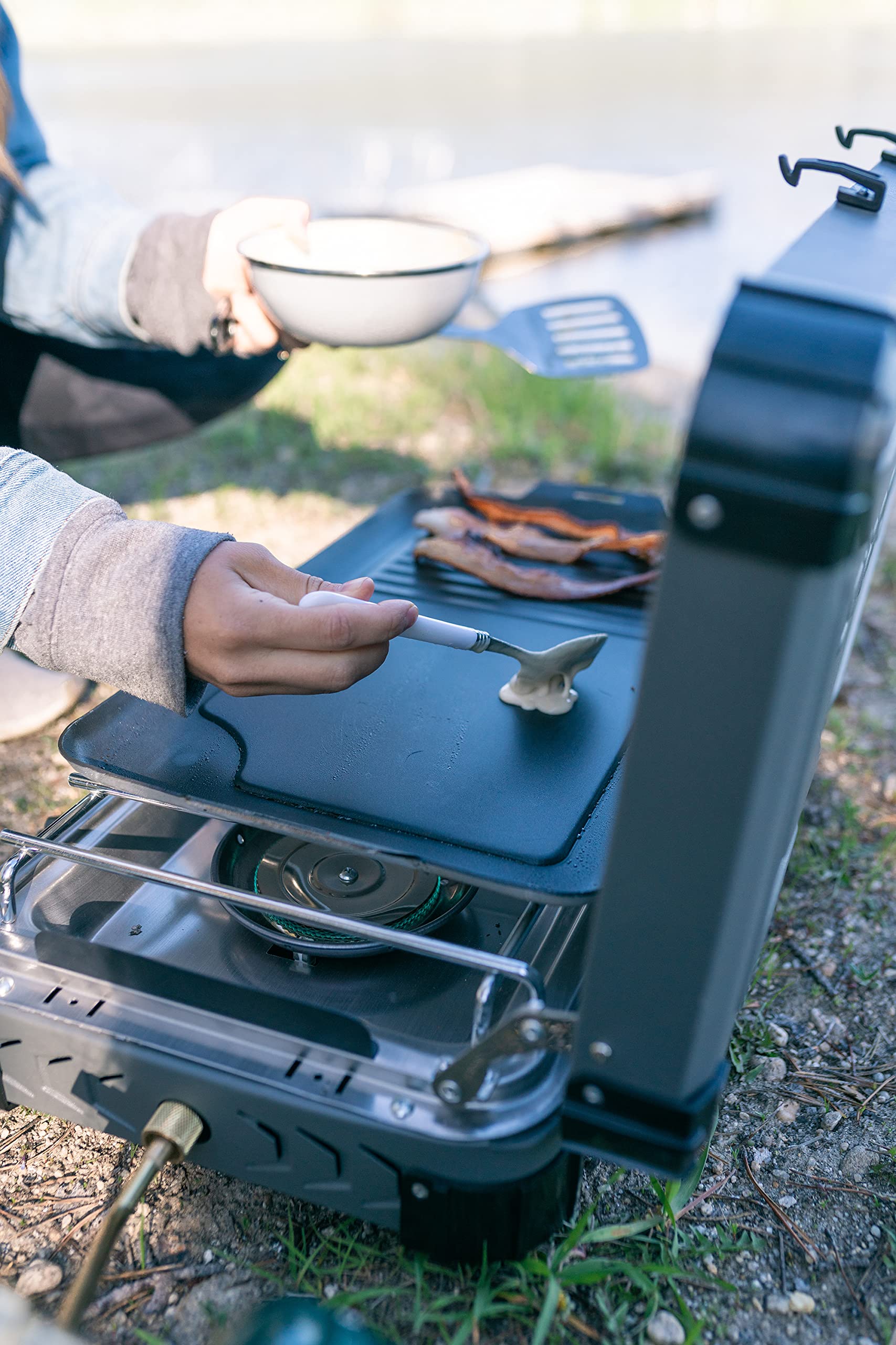 Stansport griddle on a camp stove cooking for fast, even outdoor meals
