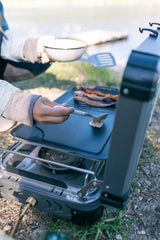Stansport griddle on a camp stove cooking for fast, even outdoor meals