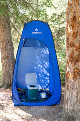 Stansport compact toilet fitting in car trunk illustrating travel-friendly size