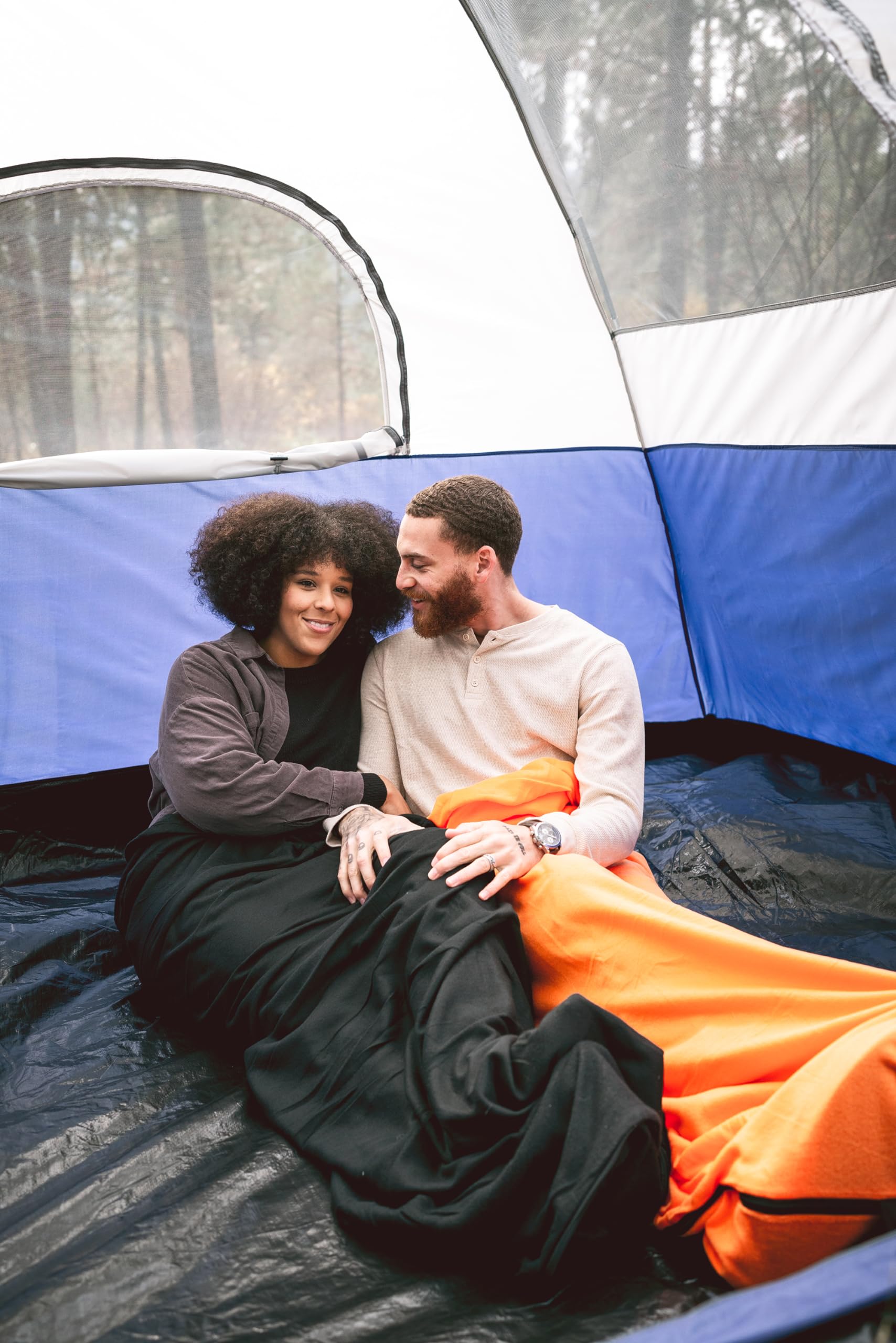 Stansport sleeping bag next to measuring tape showing 32 x 75 inch dimensions