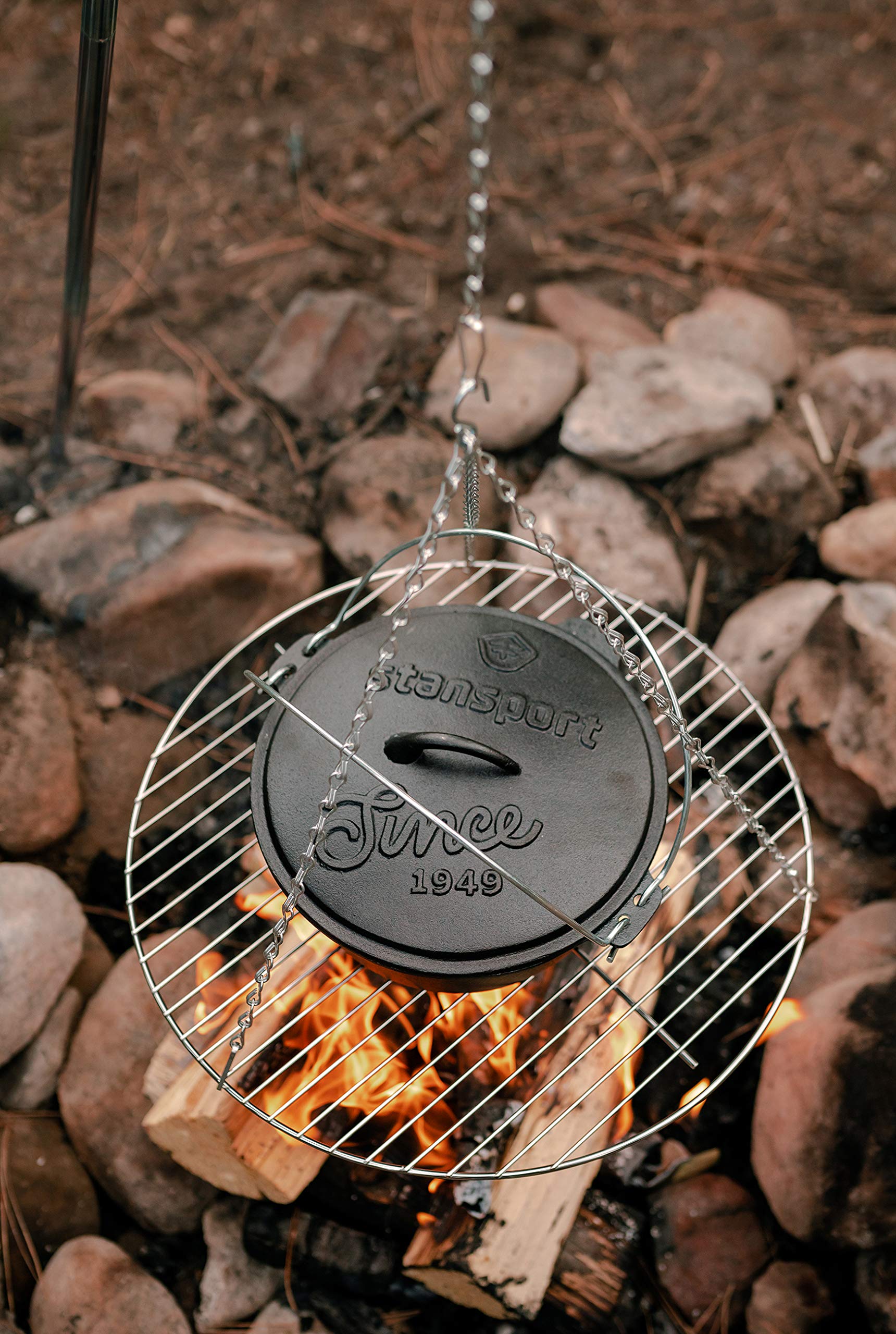 Stansport tripod over campfire with pot demonstrating stable cooking benefit
