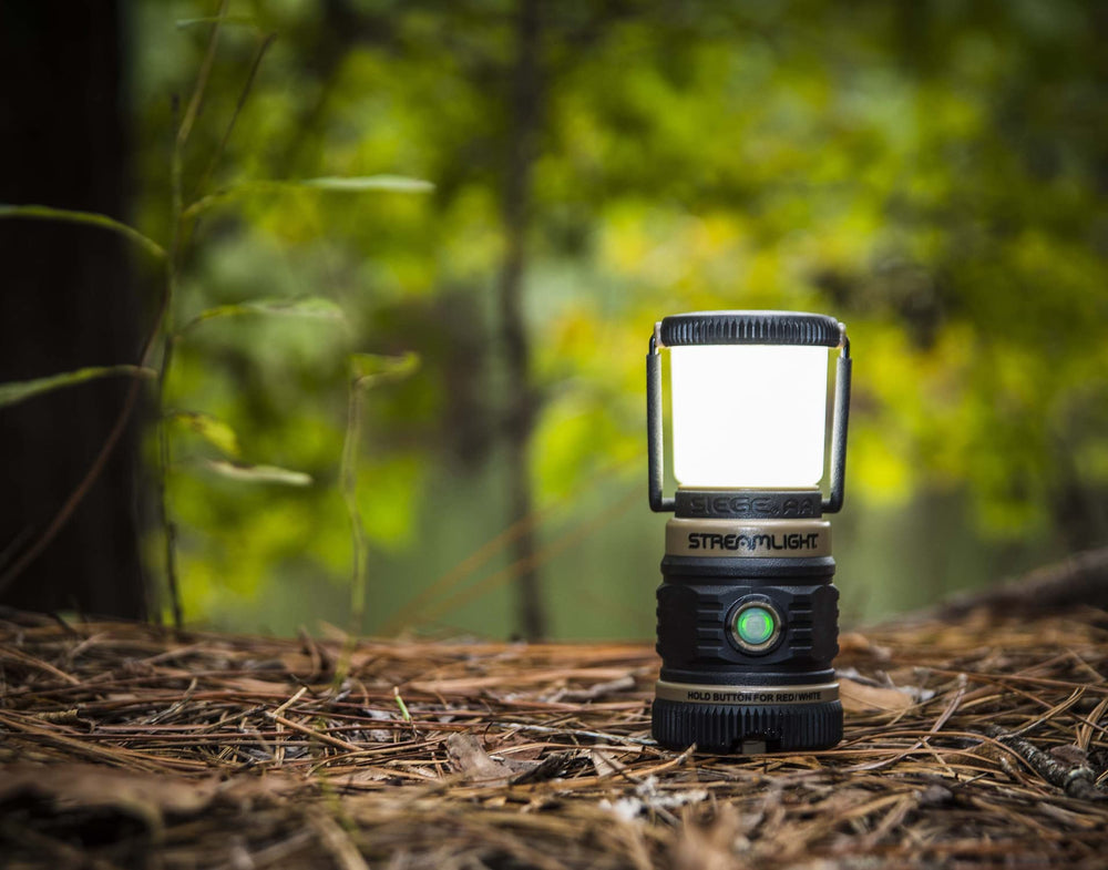 Streamlight Siege AA next to AA batteries illustrating compact size and common battery compatibility benefit