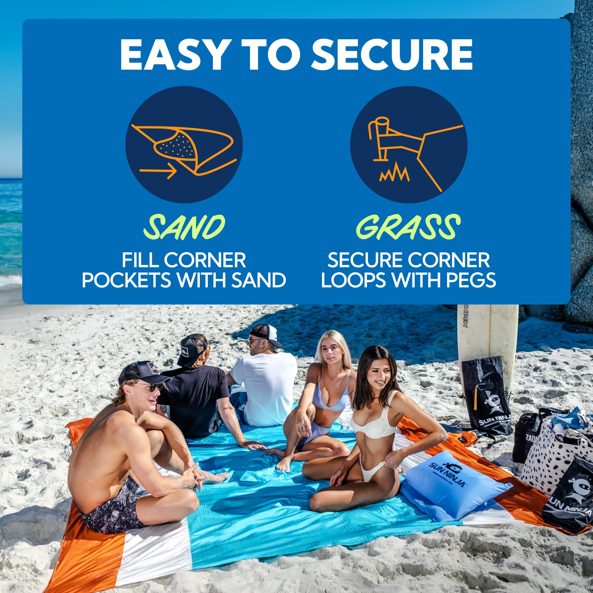 SUN NINJA corner staked into sand demonstrating stability against wind