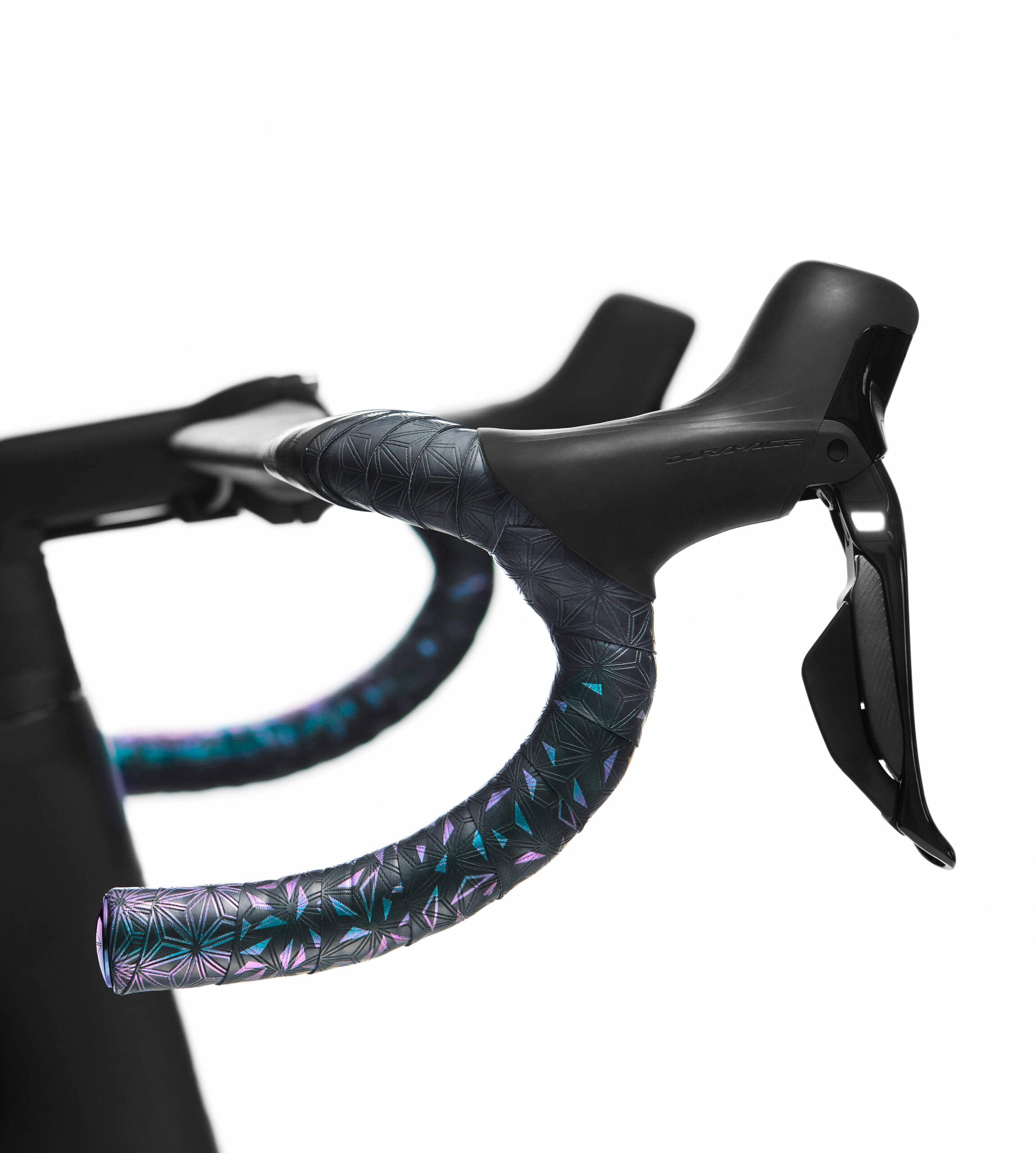 Supacaz Oil Slick Star Plugz mounted, anodized finish adds durable cockpit accent