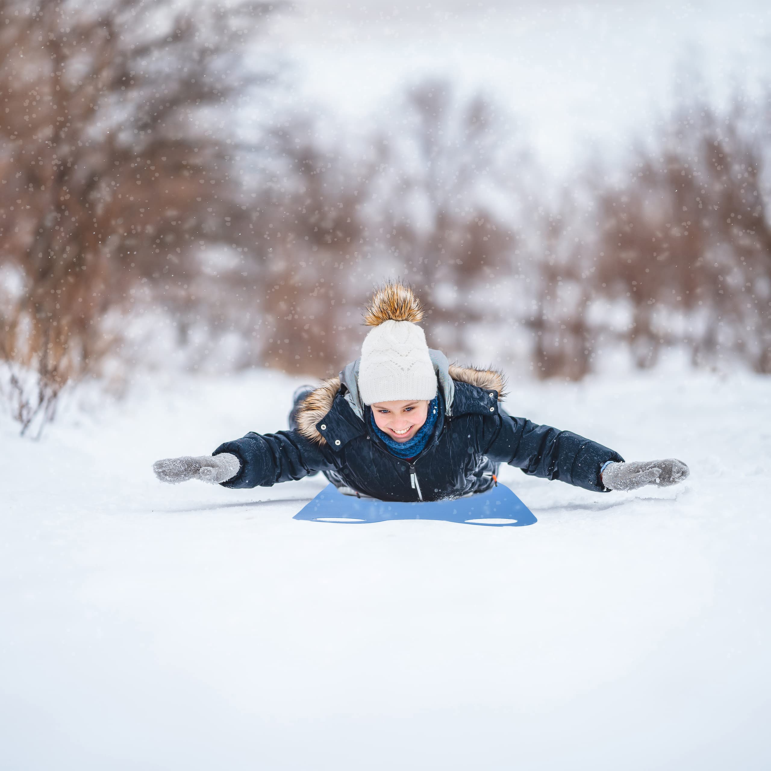 Superio snow slider mat in winter lifestyle scene ready for family outings