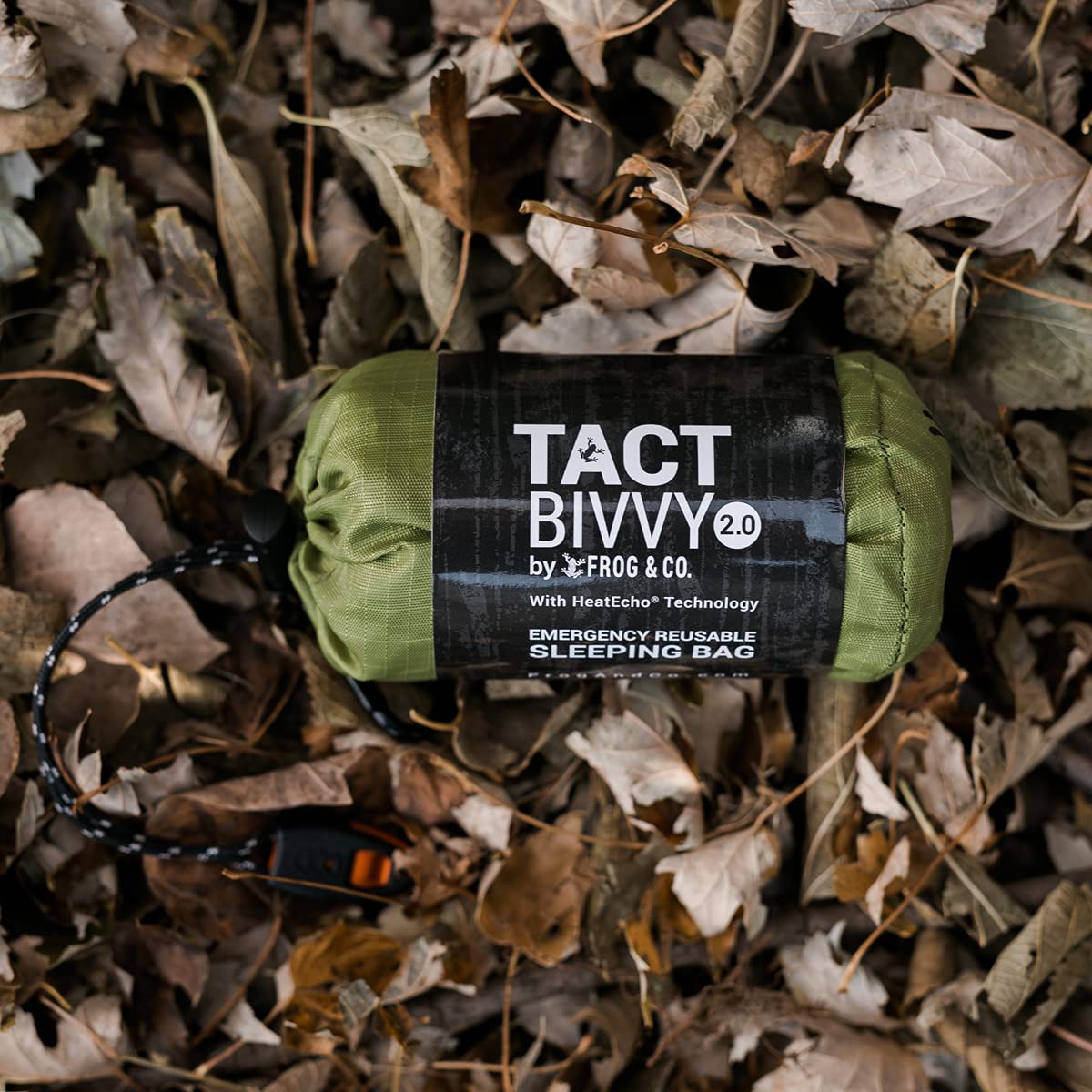 Survival Frog bright orange bivvy on trail aiding high-visibility rescue identification