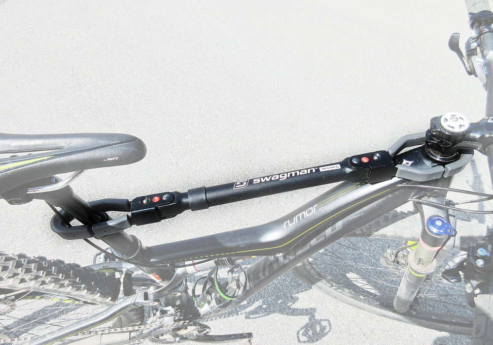 Swagman bar adapter mounted on hitch rack carrying a kids bike for secure travel
