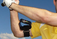 Swing Extender worn by golfer on range demonstrating improved arm extension and control