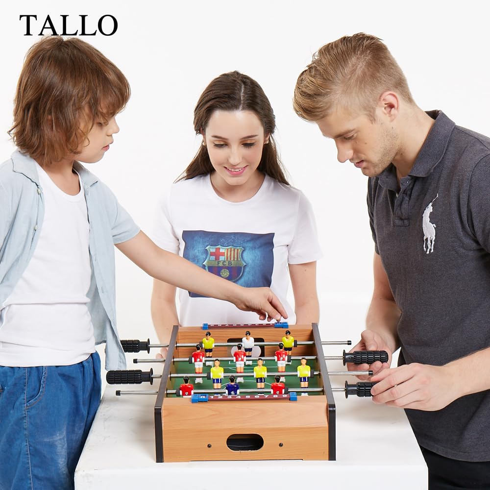 TALLO foosball table beside a chair showing 20-inch scale for easy portability