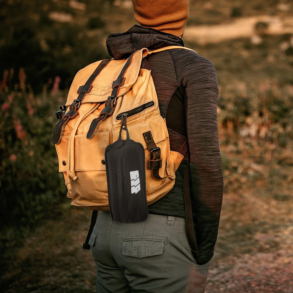 TANSTRIDER next to backpack showing compact size and weight benefit
