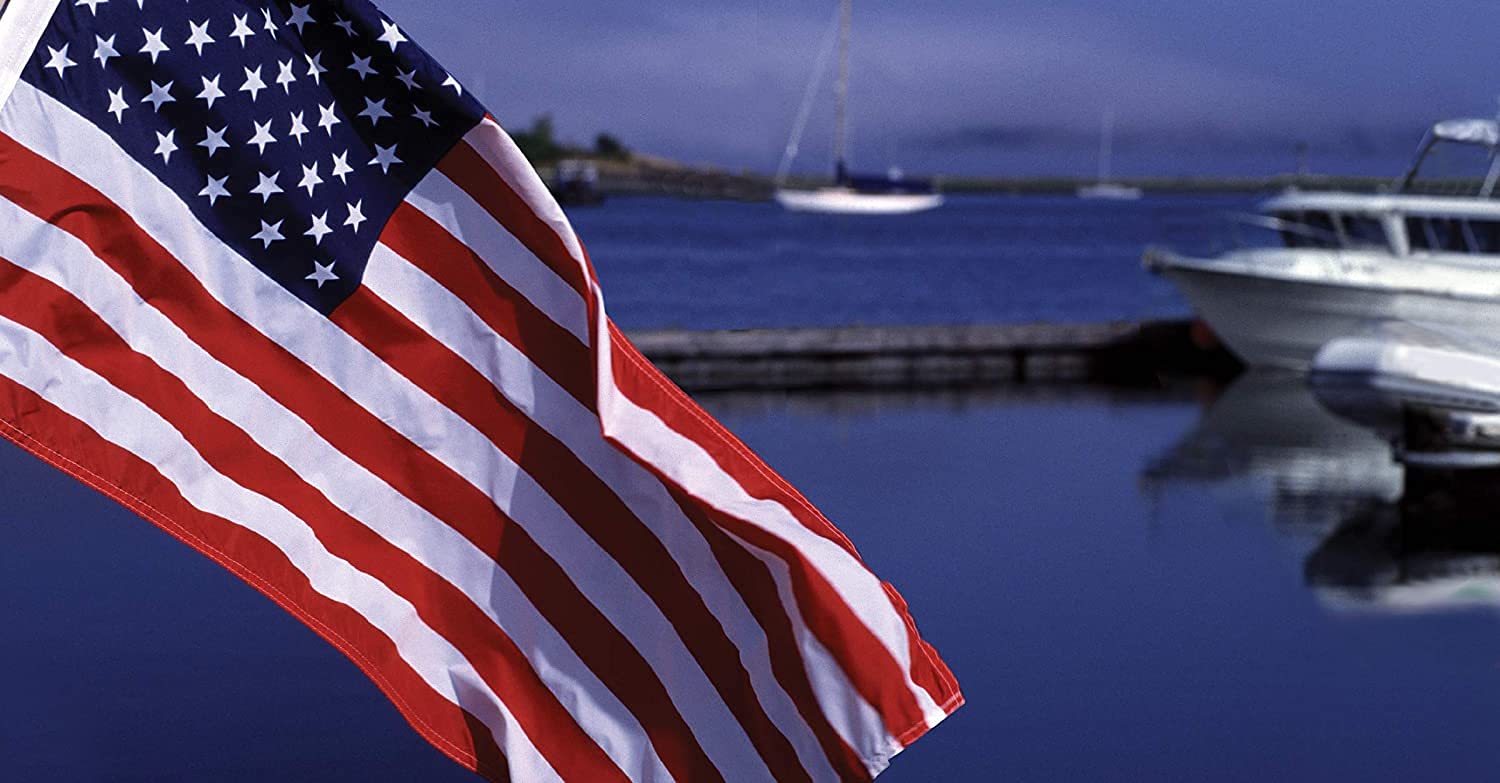 TaylorMade flag displayed on a dock in lifestyle setting showcasing outdoor resilience