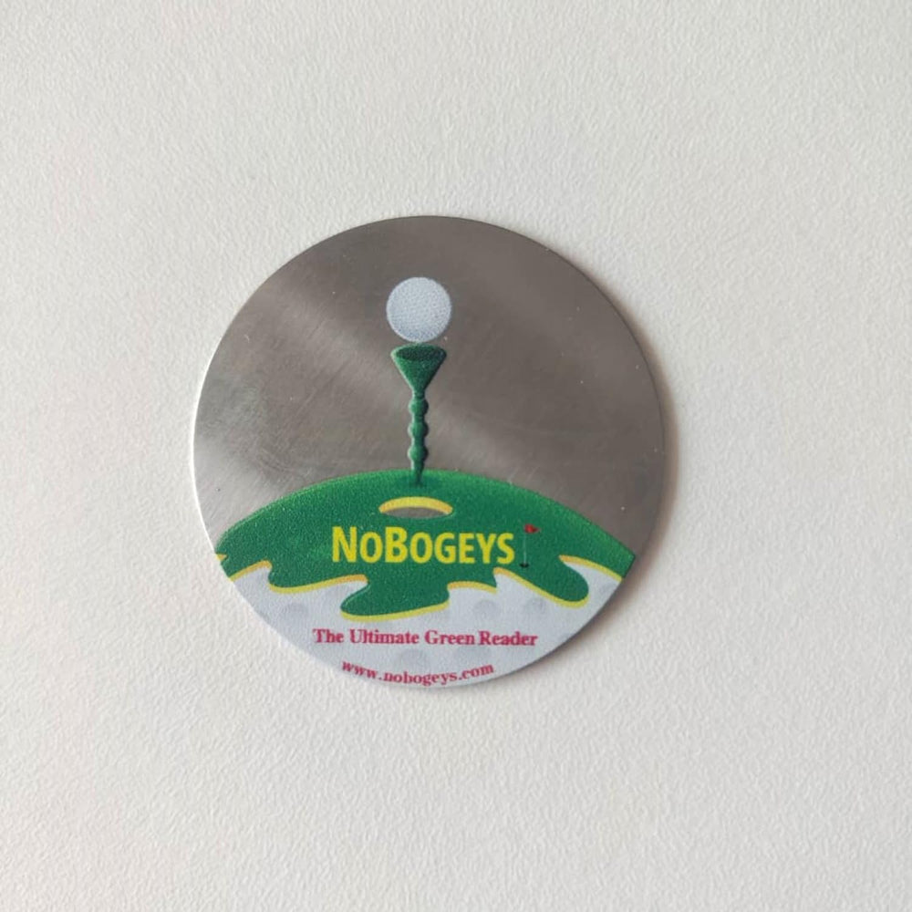 Tee Time Tees marker next to golf tee showing compact size benefit