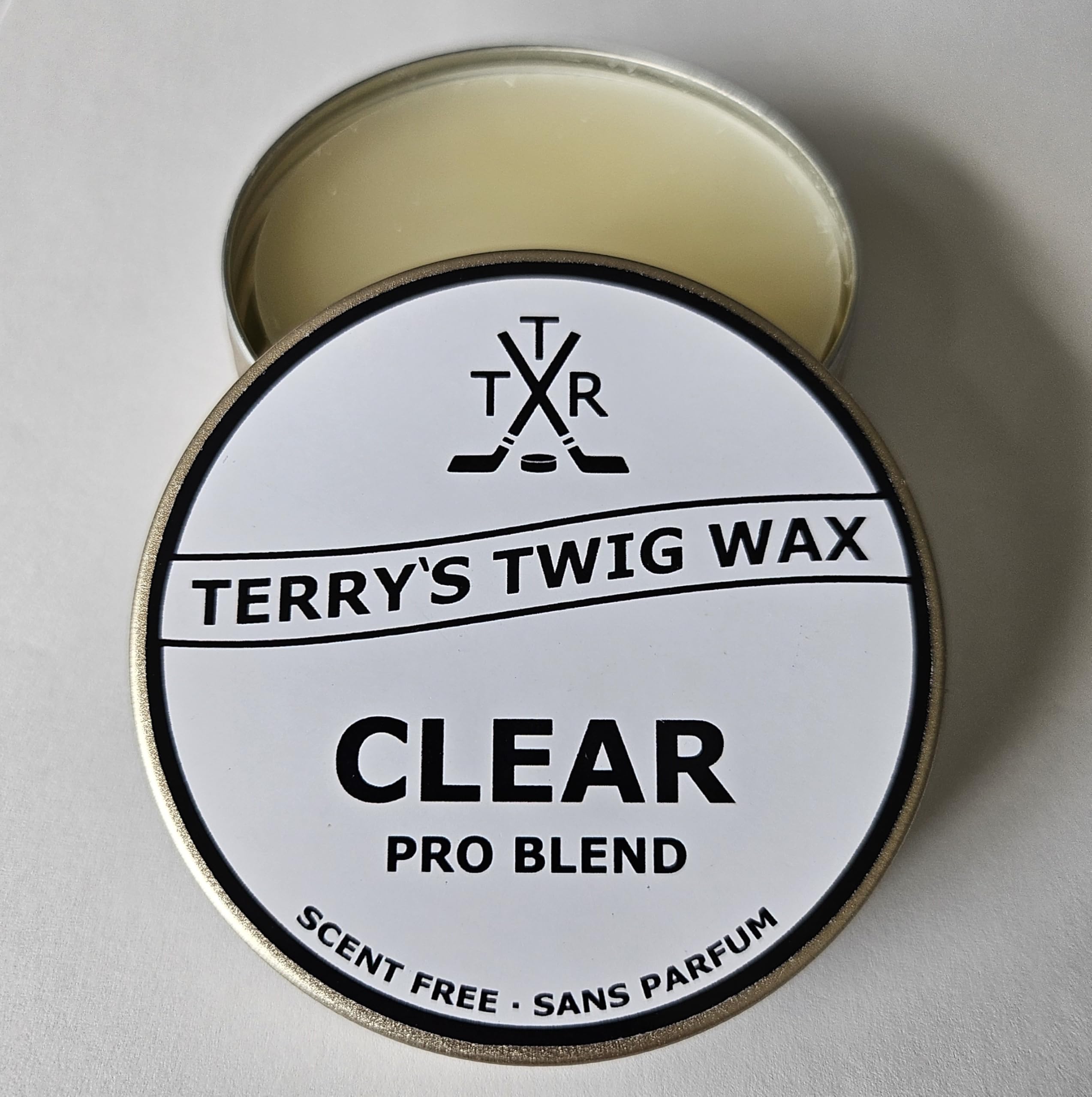 Terry's Twig Wax tin front showing clear pro blend and easy application benefit