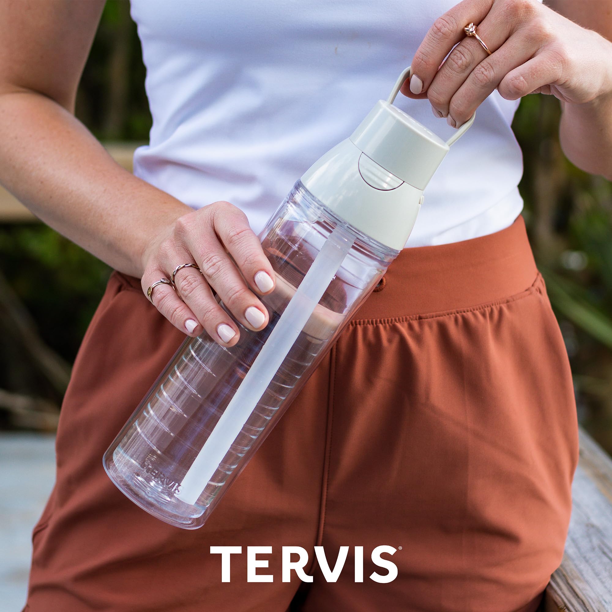 Tervis bottle on picnic table outdoors, stylish hydration on the go
