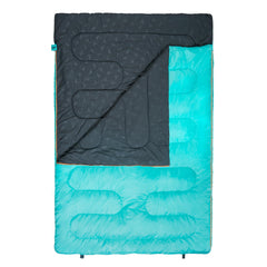 TETON Sports open flat as blanket beside campfire for versatile outdoor comfort