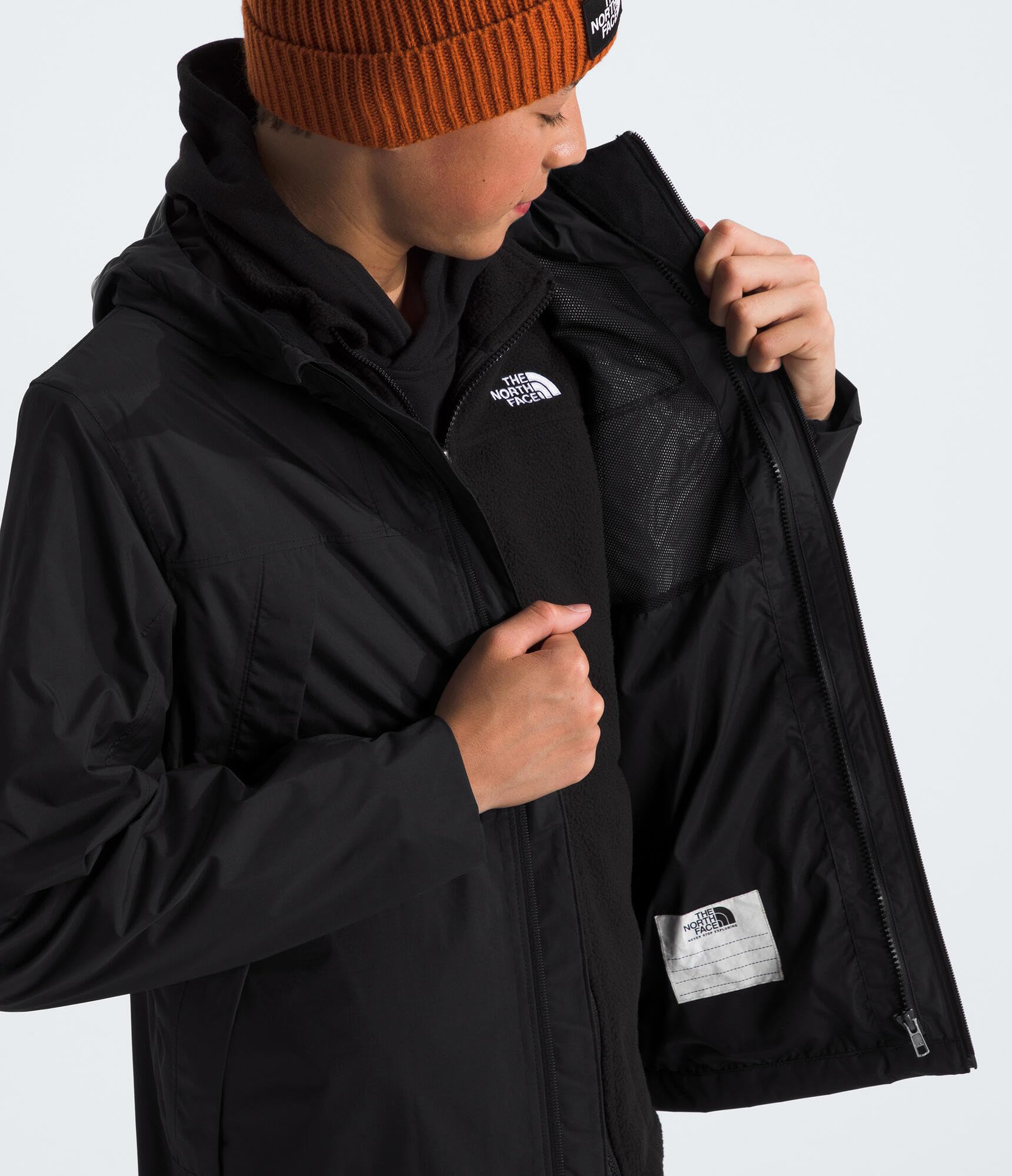 The North Face teen wearing jacket with backpack for everyday versatility benefit