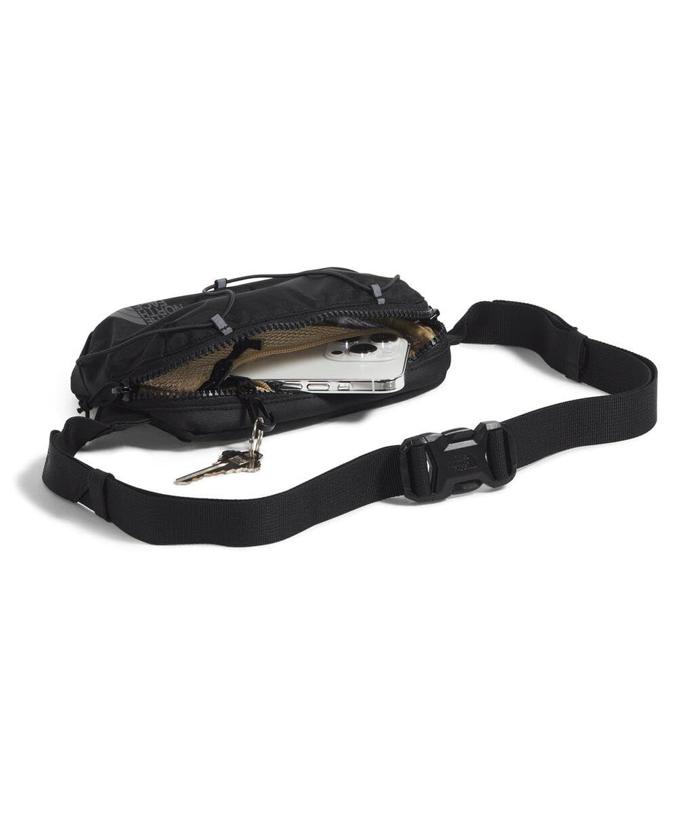 The North Face Terra Lumbar zippered pocket detail showing organized storage and key clip