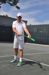 Player using The Total Serve ServeMaster to practice serve motion and timing