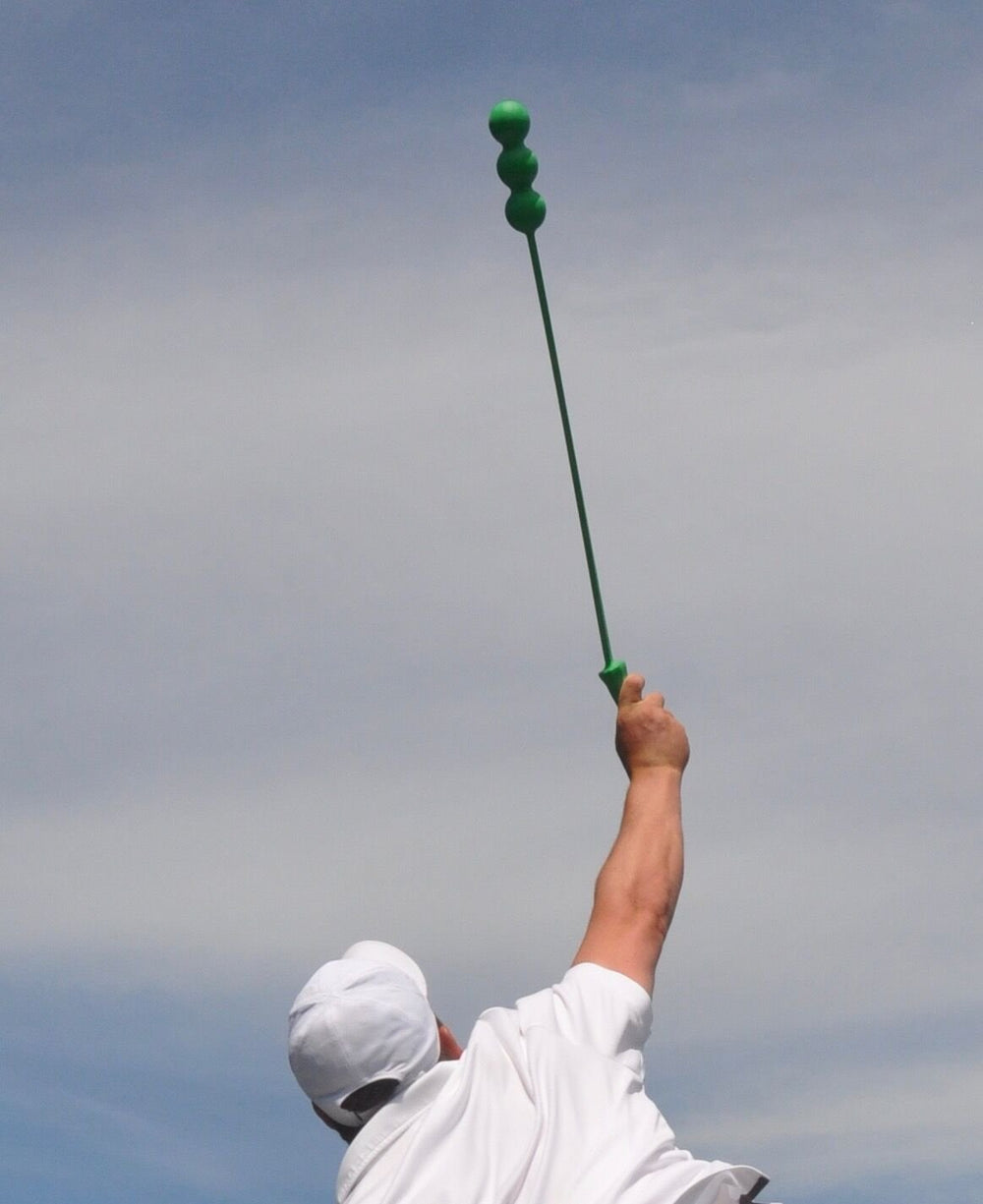 Athlete warming up with The Total Serve ServeMaster for tempo and mobility