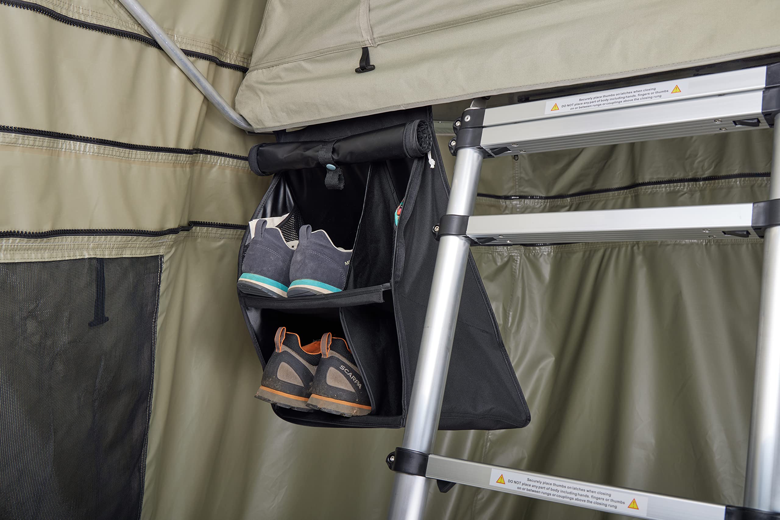 Thule organizer size comparison with hand showing compactness