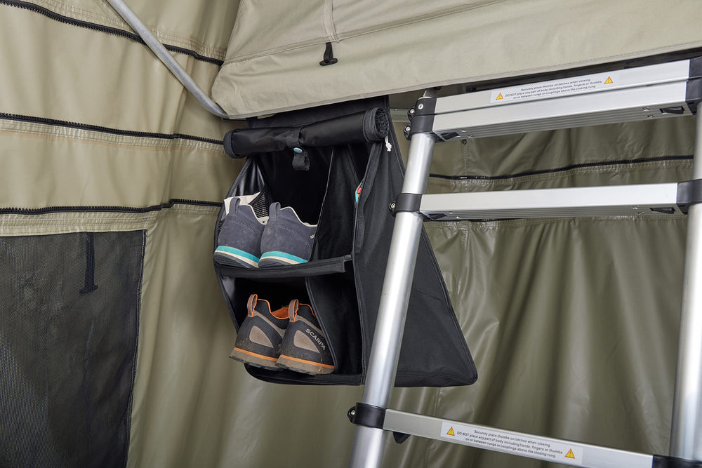 Thule organizer size comparison with hand showing compactness