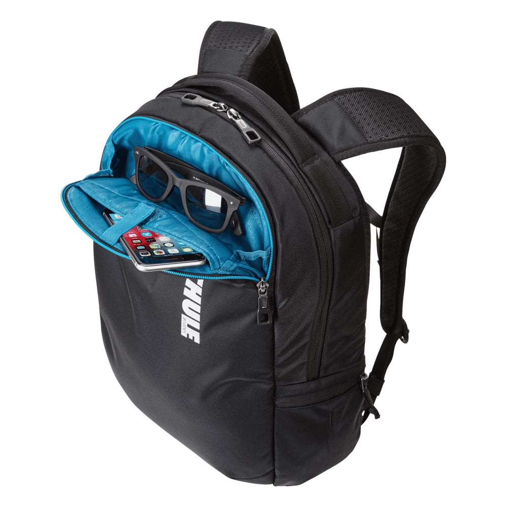 Thule Subterra expandable side pocket holding a water bottle securely