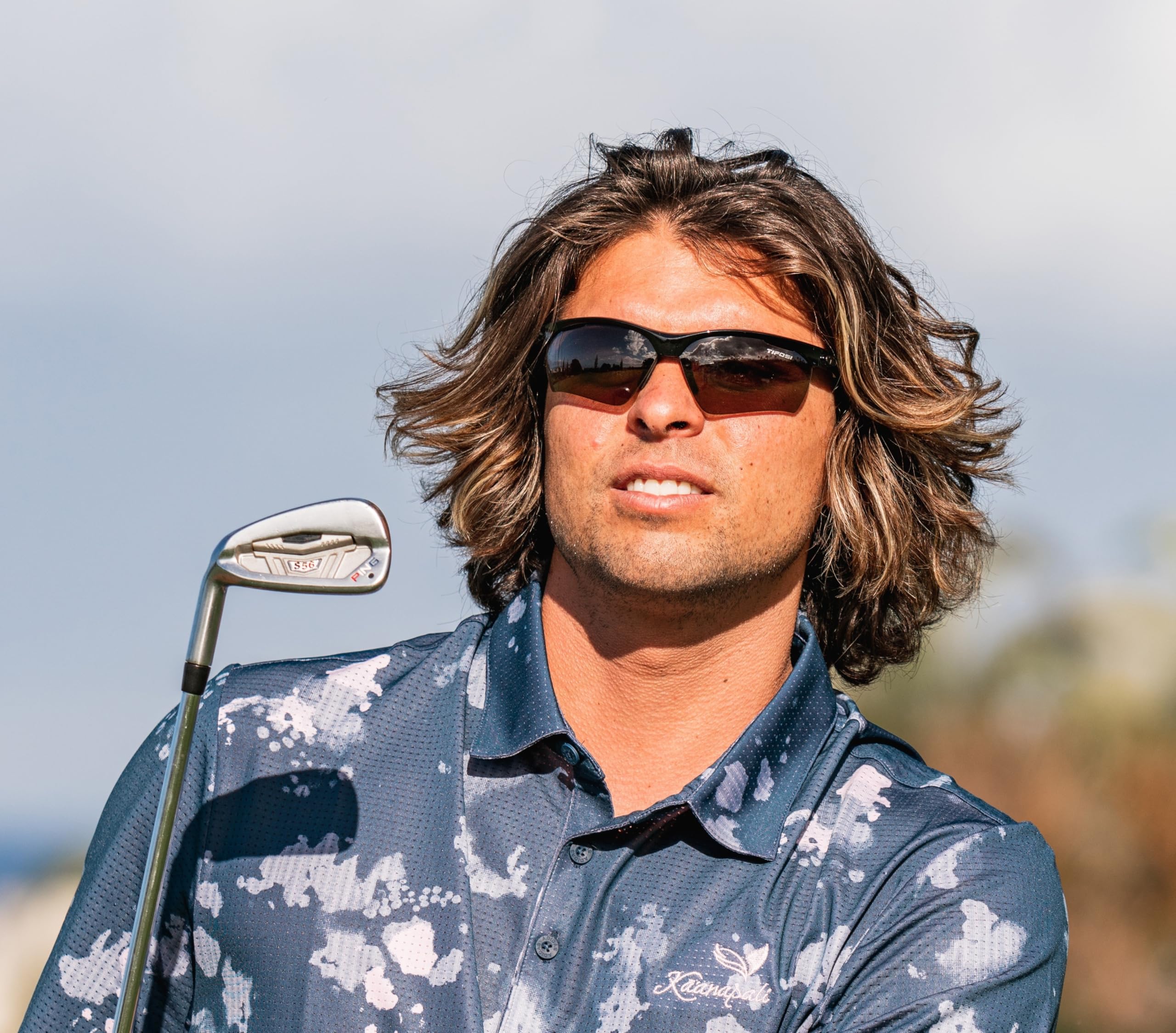 Golfer wearing Tifosi Vero Golf during swing demonstrating secure fit and clear sight