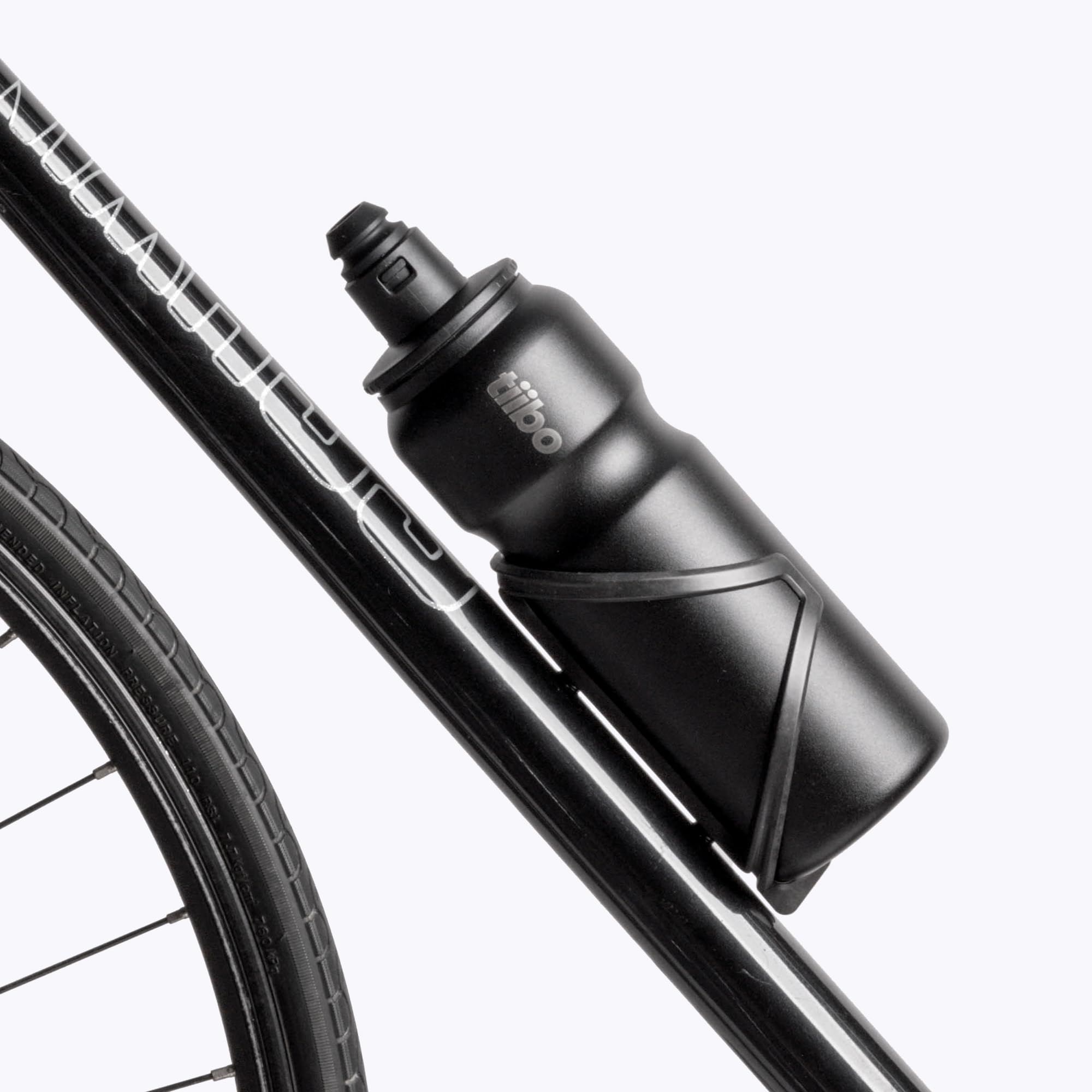 tiibo bottle held in hand showing 17oz scale and comfortable carry benefit