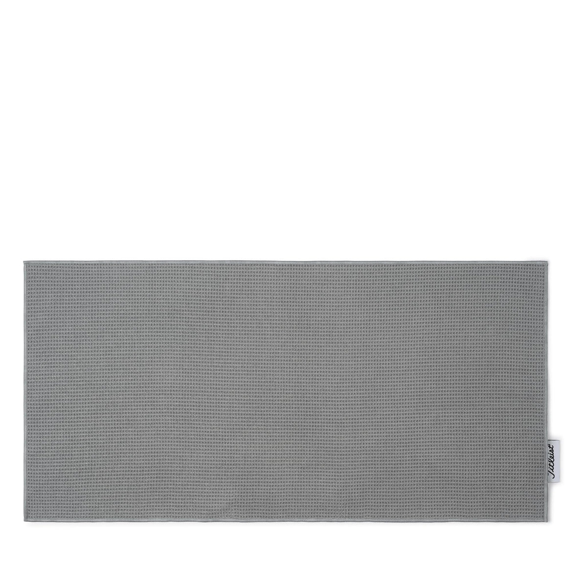 Titleist players towel front view showing gray color and woven logo, professional finish benefit