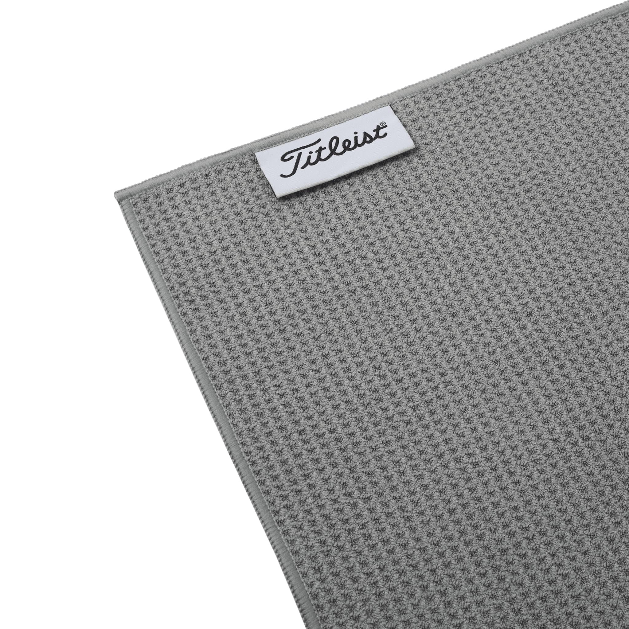 Titleist towel clipped to a golf bag demonstrating portability and easy access benefit