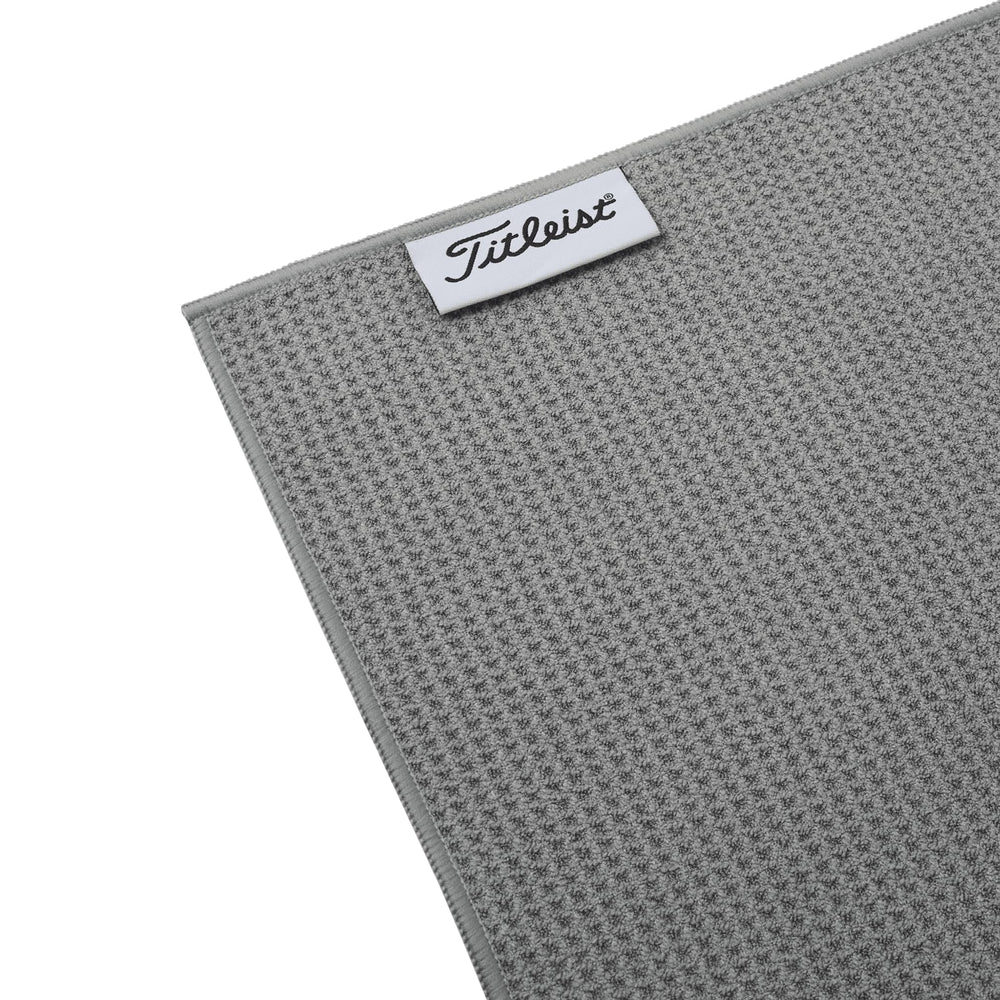 Titleist towel clipped to a golf bag demonstrating portability and easy access benefit